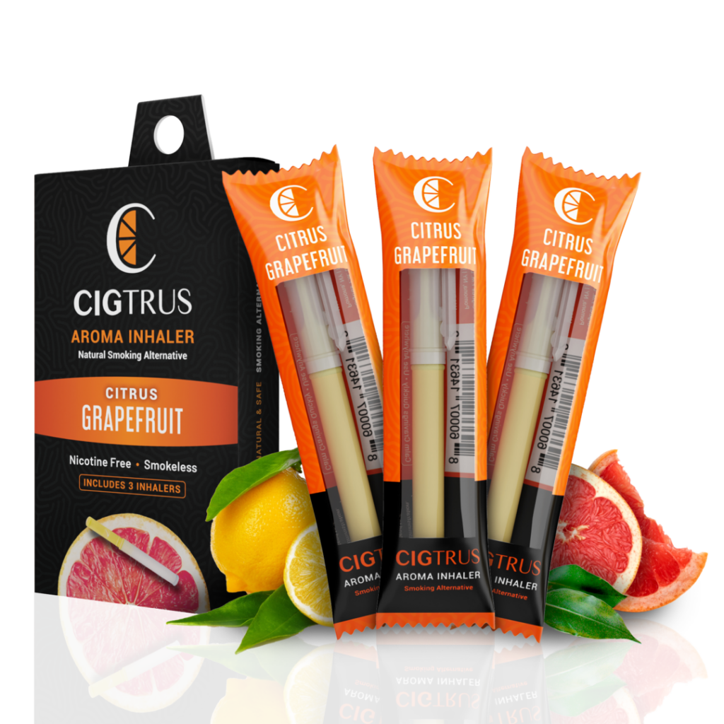Citrus grapefruit aroma inhaler pack with three smokeless, nicotine-free inhalers, surrounded by fresh oranges and grapefruit.